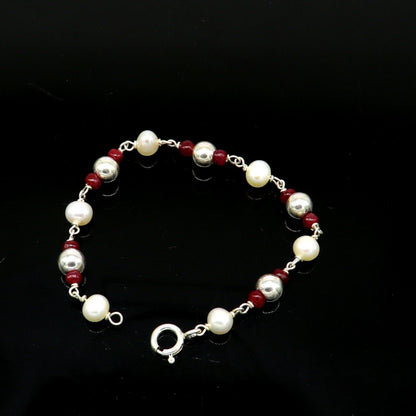 Sterling silver and pearl beaded baby bracelet by Tribal Ornaments, handmade and customized for newborns and kids jewelry.