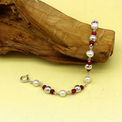 Sterling silver and pearl beaded baby bracelet with custom design, handmade baby jewelry by TRIBAL ORNAMENTS for newborns.