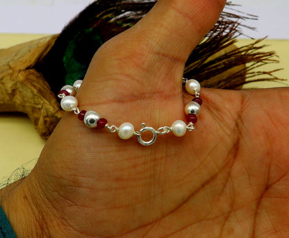 Sterling silver and pearl beaded baby bracelet by TRIBAL ORNAMENTS, handmade, customized newborn jewelry for infants.