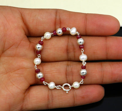 Sterling silver and pearl beaded baby bracelet by Tribal Ornaments, featuring handmade customizable jewelry for newborns and kids.