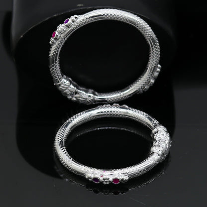 Sterling silver baby bangle bracelet with a detailed elephant face design, crafted by TRIBAL ORNAMENTS for kids.