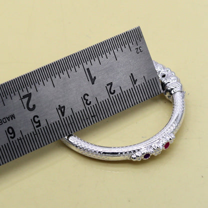 Sterling silver baby bangle bracelet with a detailed elephant face design, featuring a 5mm solid silver band for kids.