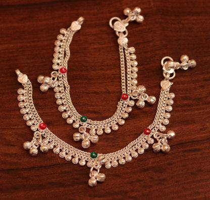 Handmade sterling silver baby ankle bracelet with hanging noisy bells and charm, unisex design for infant feet.