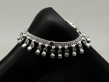 Sterling silver handmade baby anklet with hanging noisy bells and charm, unisex foot bracelet for infants and toddlers.