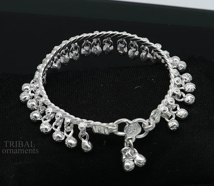 Sterling silver 6.5-inch handmade baby anklet with hanging bells, unisex foot bracelet featuring intricate tribal ornament design.