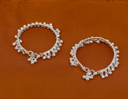 Sterling silver newborn baby anklet with hanging noisy bells, unisex foot bracelet, handcrafted by Tribal Ornaments.
