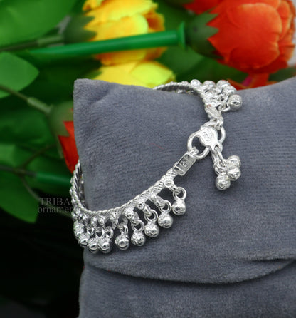 Sterling silver newborn baby anklet with hanging noisy bells, unisex foot bracelet, handmade by Tribal Ornaments.