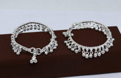 Sterling silver newborn baby anklet with hanging noisy bells, unisex foot bracelet, handmade tribal design from Tribal Ornaments.