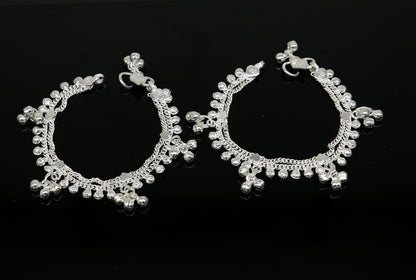 Handmade 6.5-inch sterling silver baby anklet with unisex design and customizable charm, featuring tribal ornament details.