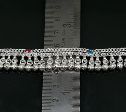 Sterling silver unisex baby ankle bracelet with custom charm, handmade for newborns and kids, featuring a delicate foot design.