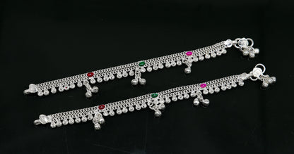 Handmade 6-inch sterling silver anklet with jingling bells and baby foot charm, crafted by Tribal Ornaments for kids jewelry.