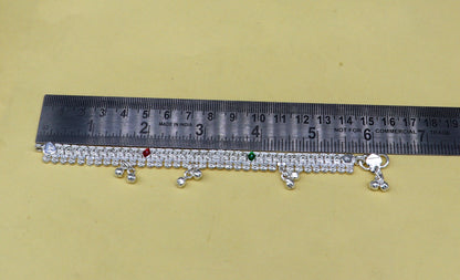 Sterling silver baby ankle bracelet with jingling charm, customized for newborns, stylish and delicate foot jewelry by TRIBAL ORNAMENTS.