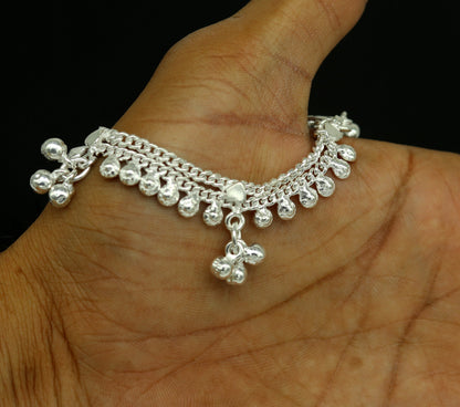 Sterling silver handmade baby ankle bracelet with noisy sound charm, personalized with custom details from TRIBAL ORNAMENTS.