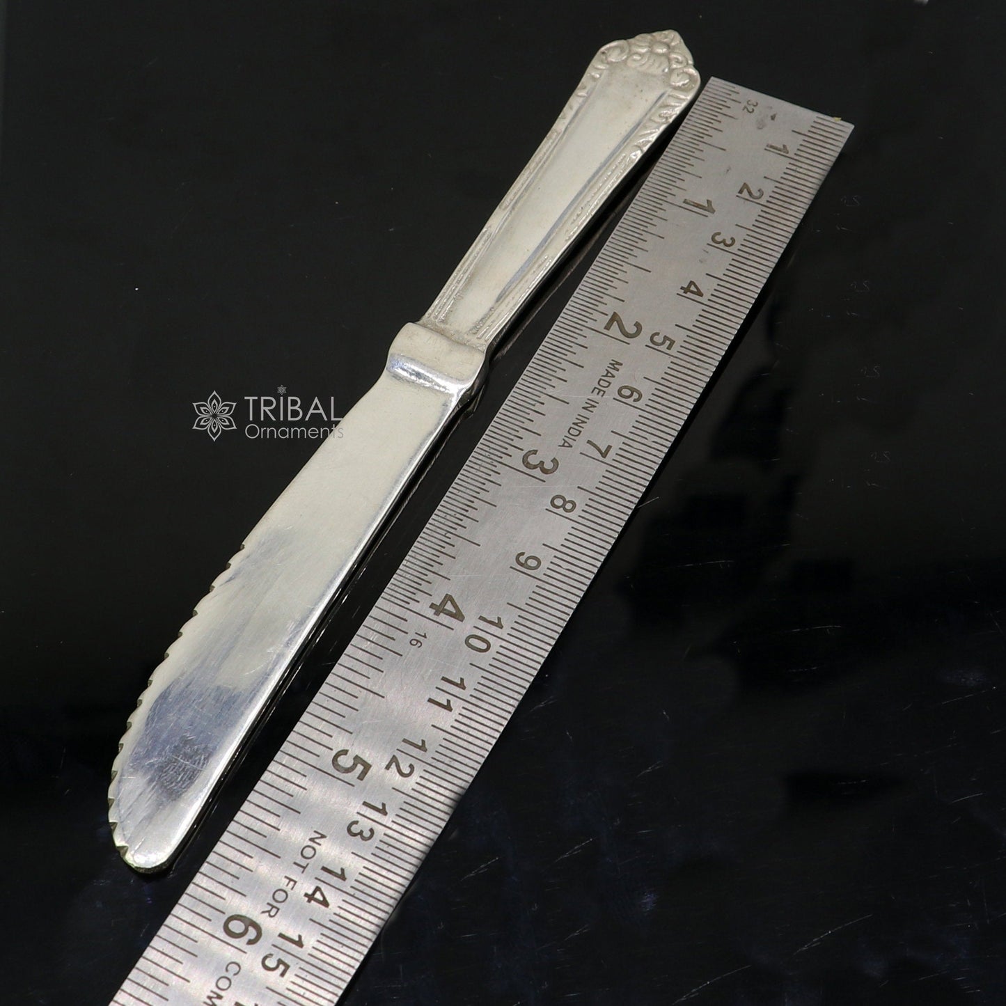 Sterling silver 6-inch butter knife by Tribal Ornaments, elegant silver utensil for food serving or luxury gifting.