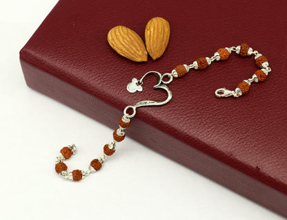 925 sterling silver Rudraksha bracelet with custom OM design, handmade tribal ornament jewelry, 7.5 inches long.
