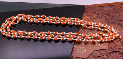 7 mm natural Rudraksha beads on a vintage sterling silver chain necklace for prayer and meditation, featuring 108 beads.