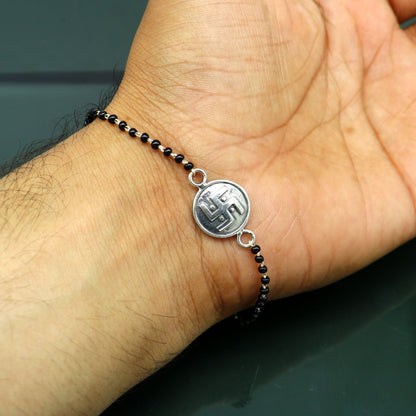 Sterling silver 8.5-inch black beaded Swastik bracelet with custom design by TRIBAL ORNAMENTS.
