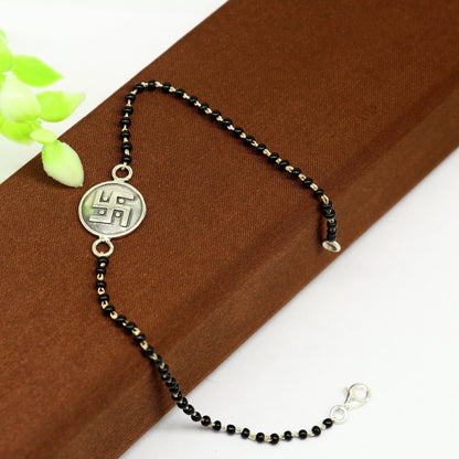 8.5-inch sterling silver Swastik bracelet with black beads, customized design, by TRIBAL ORNAMENTS.