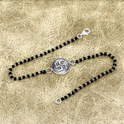 8.5-inch sterling silver beaded bracelet with black beads and Swastik charm from TRIBAL ORNAMENTS