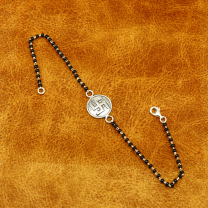 Sterling silver 8.5-inch black beaded Swastik bracelet with customized design by TRIBAL ORNAMENTS.