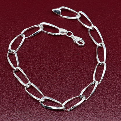 Elegant 925 sterling silver chain bracelet by TRIBAL ORNAMENTS featuring a stylish, handmade solid design for gifting or everyday wear.