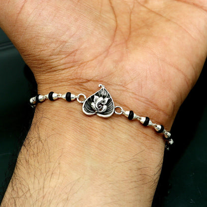 925 sterling silver Ganesha design tulsi beaded bracelet with intricate detailing, perfect as a Rakhi gift or personal accessory.