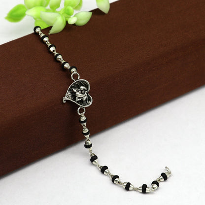 925 sterling silver Ganesha design tulsi beaded bracelet with intricate detailing, ideal for rakhi or special occasions.