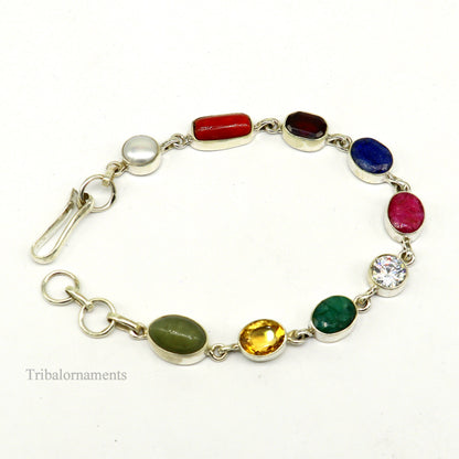 Sterling silver Navratan nine-stone bracelet featuring colorful stones, handmade stylish jewelry from Rajasthan, India.