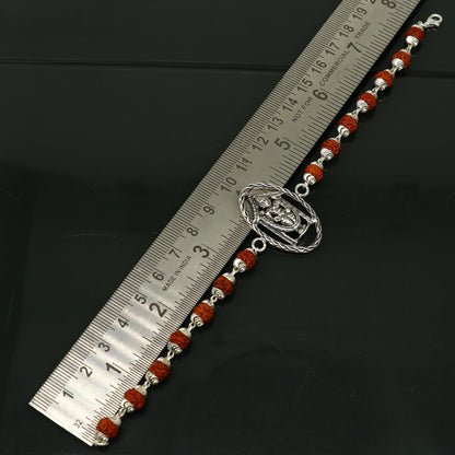 8-inch sterling silver Tirupati Balaji design bracelet with rudraksha beads, handcrafted by Tribal Ornaments.