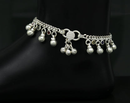 Sterling silver toddler anklet with hanging noisy bells and multicolor stone charms, designed for young children.