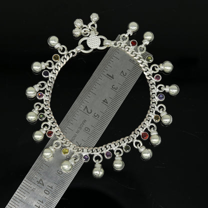 Sterling silver toddler anklet with hanging noisy bells and multicolor stones, charming ankle bracelet for young children.