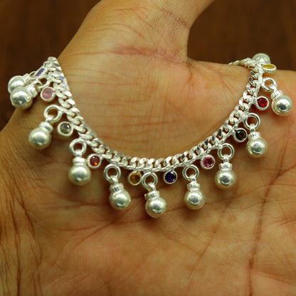 Sterling silver toddler anklet with hanging noisy bells and multicolor stones, charming ankle bracelet for young children.