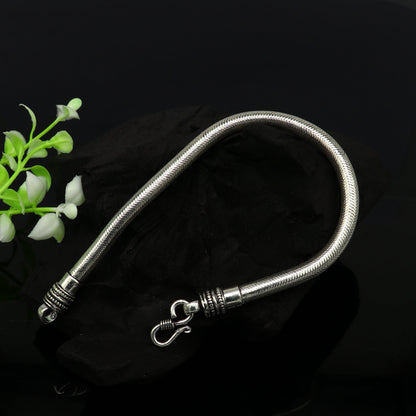 Sterling silver 9-inch, 5mm handmade snake chain bracelet by TRIBAL ORNAMENTS, stylish and customizable jewelry for gifting.
