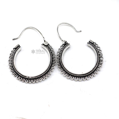 Sterling silver tribal earrings with unique round hoop design, ethnic hanging style, crafted by TRIBAL ORNAMENTS.