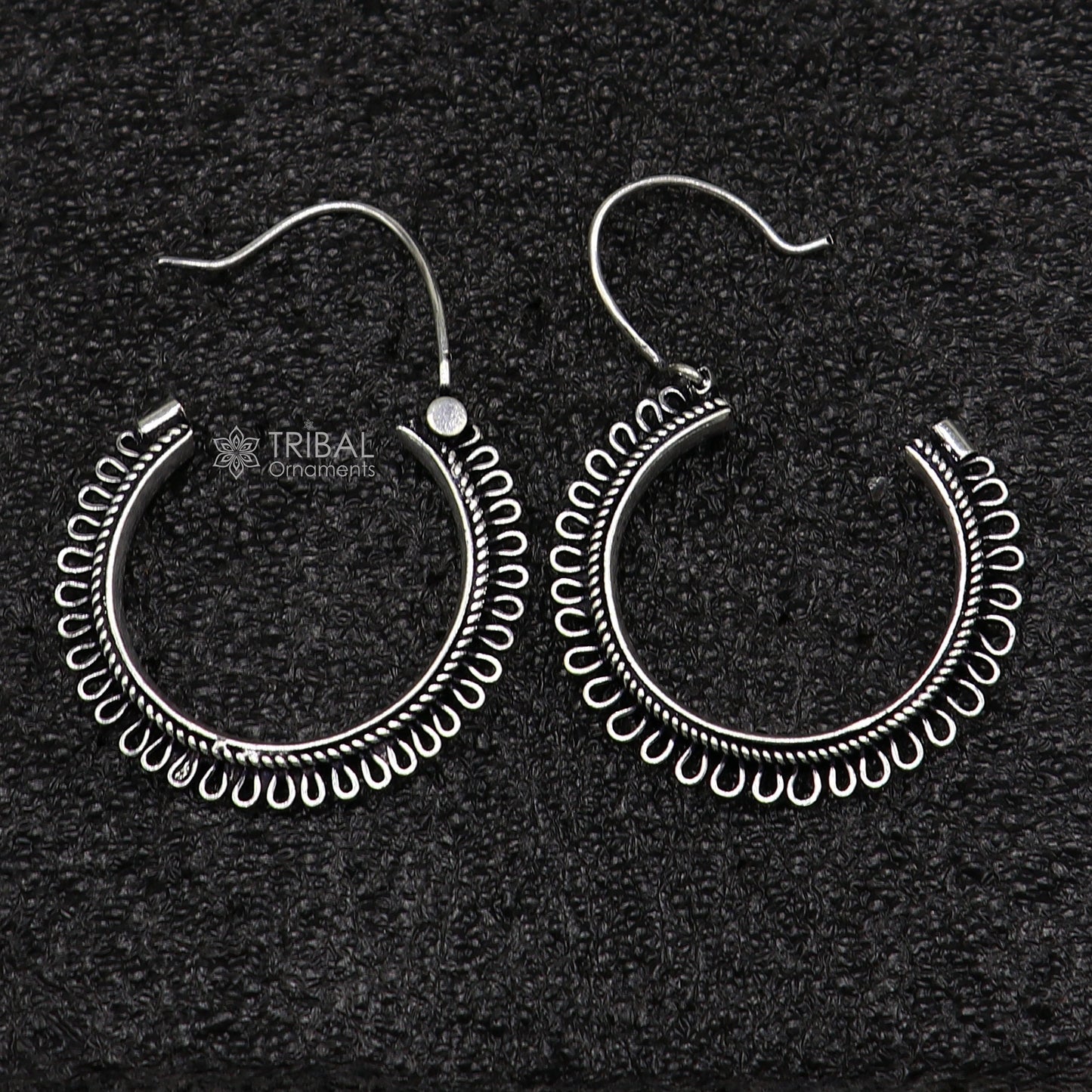 Sterling silver tribal hoop earrings with unique round design, ethnic hanging style, crafted by TRIBAL ORNAMENTS.