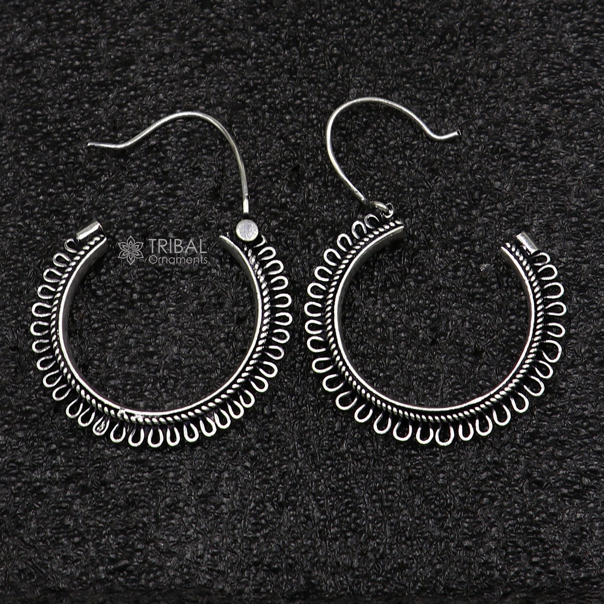Sterling silver tribal hoop earrings with unique round design, ethnic hanging style, crafted by TRIBAL ORNAMENTS.