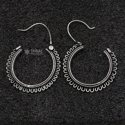 Sterling silver tribal hoop earrings with unique round design, ethnic hanging style, crafted by TRIBAL ORNAMENTS.