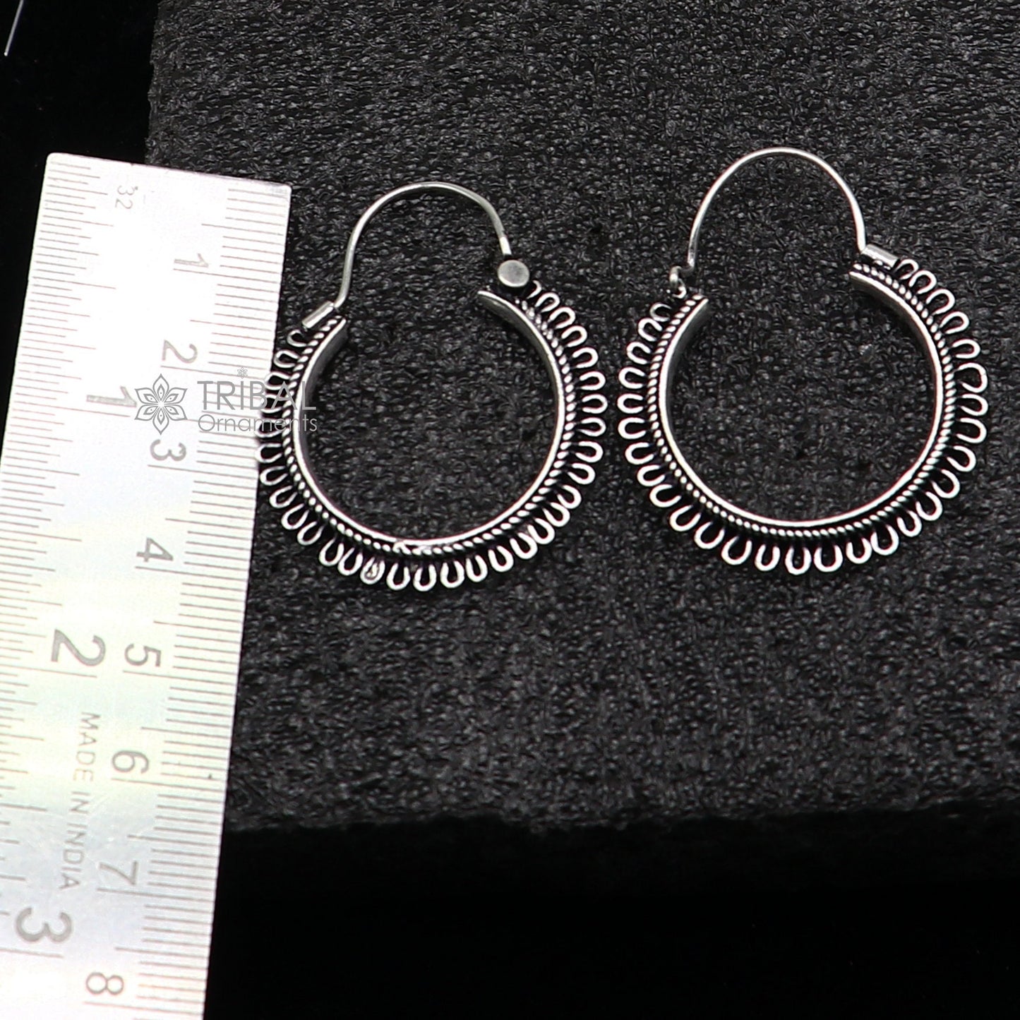 Sterling silver tribal hoop earrings with unique round design, hanging earrings featuring ethnic and tribal-inspired jewelry style.