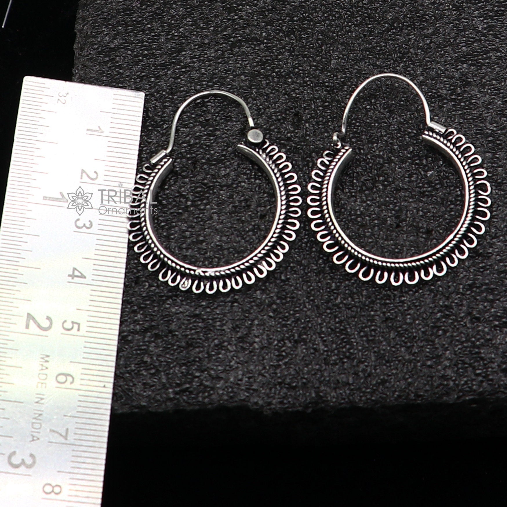 Sterling silver tribal hoop earrings with unique round design, hanging earrings featuring ethnic and tribal-inspired jewelry style.