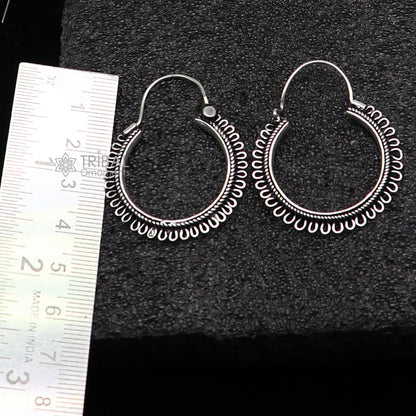 Sterling silver tribal hoop earrings with unique round design, hanging earrings featuring ethnic and tribal-inspired jewelry style.