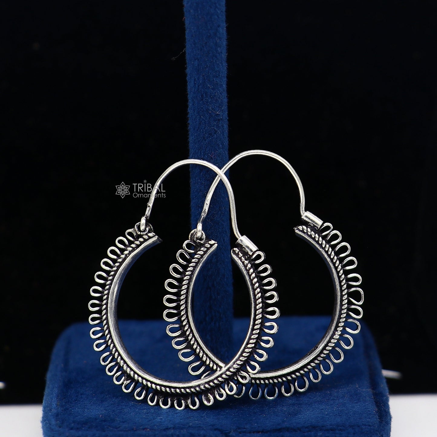 Sterling silver tribal hoop earrings with unique round design, ethnic style, and hanging functional jewelry from TRIBAL ORNAMENTS.