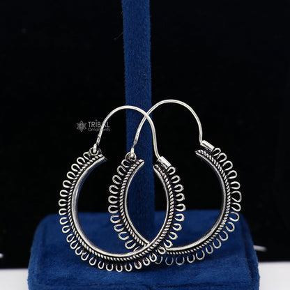 Sterling silver tribal hoop earrings with unique round design, ethnic style, and hanging functional jewelry from TRIBAL ORNAMENTS.
