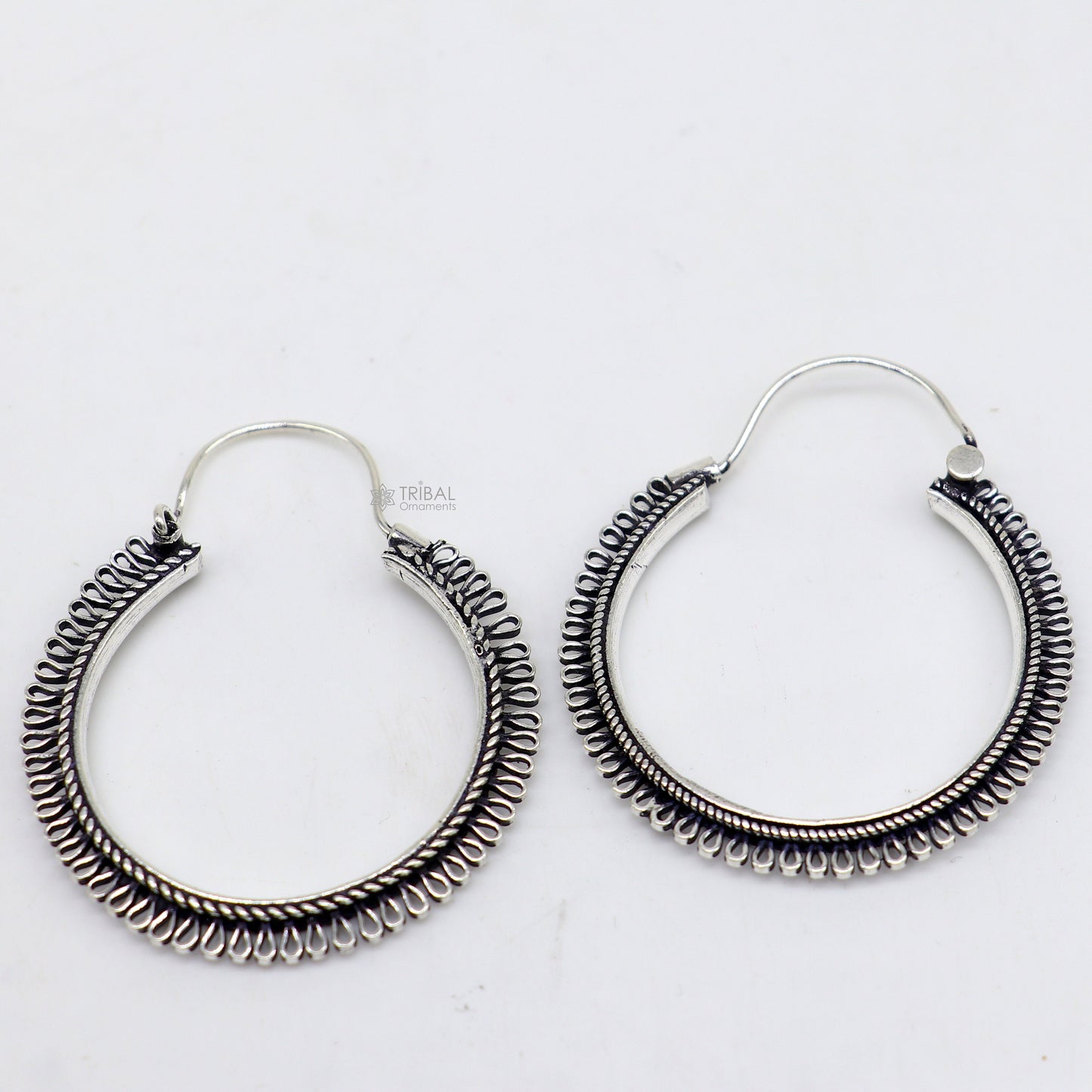 Sterling silver tribal earrings with unique round hoop design, ethnic hanging style, handcrafted jewelry by TRIBAL ORNAMENTS.