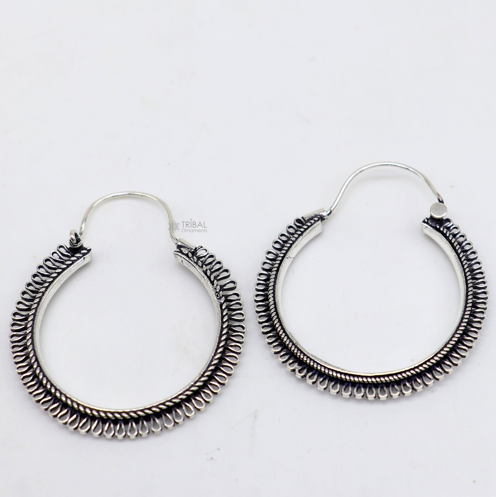 Sterling silver tribal earrings with unique round hoop design, ethnic hanging style, handcrafted jewelry by TRIBAL ORNAMENTS.