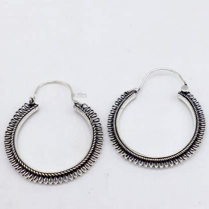Sterling silver tribal earrings with unique round hoop design, ethnic hanging style, handcrafted jewelry by TRIBAL ORNAMENTS.