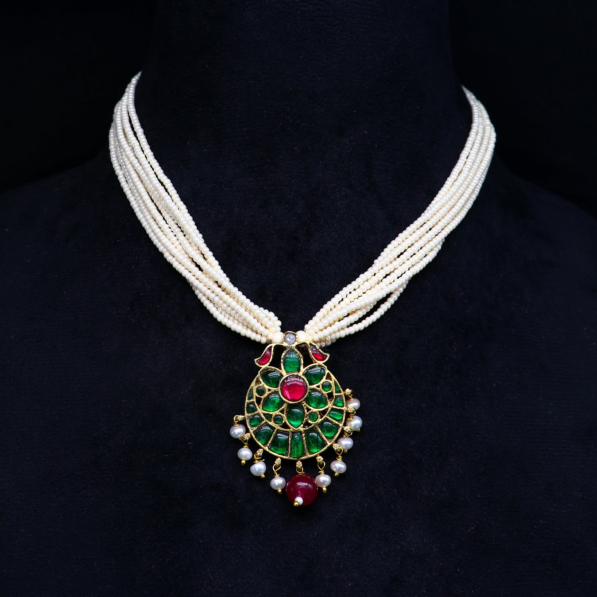 Sterling silver India traditional kundan work pendant with peacock design, decorated with multiline pearl strings in jewelry set.