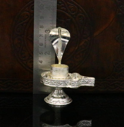 Sterling silver Lord Shiva Lingam stand by Tribal Ornaments, handcrafted for holding Shiva Lingam in home temple decor.