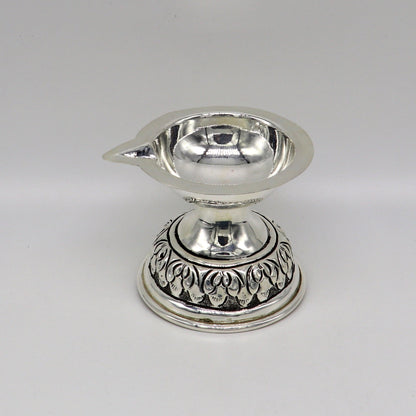 Sterling silver oil lamp with intricate chitai and kandrai work, featuring traditional deepak design for puja and temple decor.