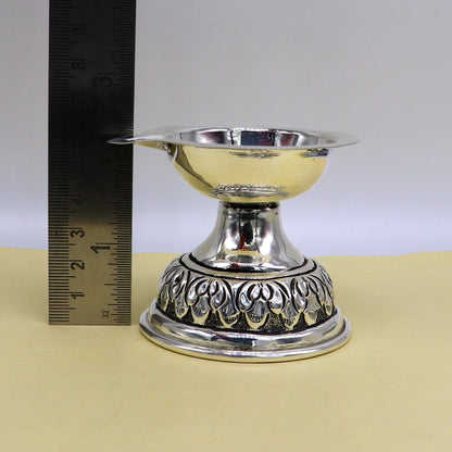 Sterling silver oil lamp with Chitai and Kandrai work design, traditional Deepak temple article, detailed puja utensil figurine.