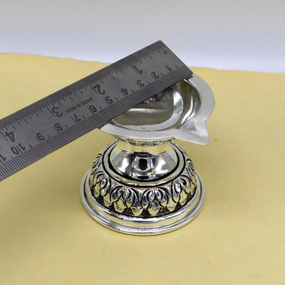 Sterling silver oil lamp with intricate chitai and kandrai work, traditional Deepak temple figurine for puja rituals.